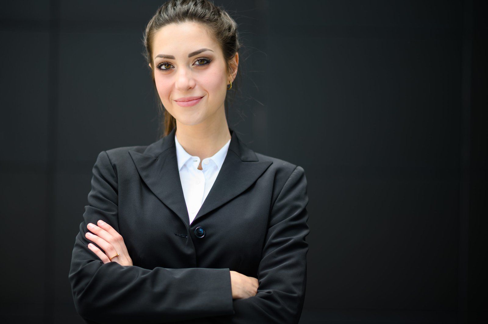 Confident young female manager outdoor in a modern urban setting